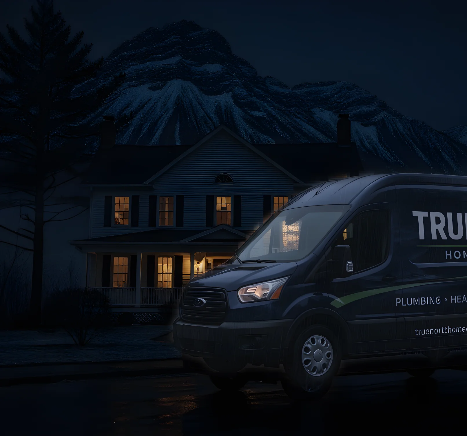 Warm-lit colonial Maine home at dusk with mountains and moody twilight sky